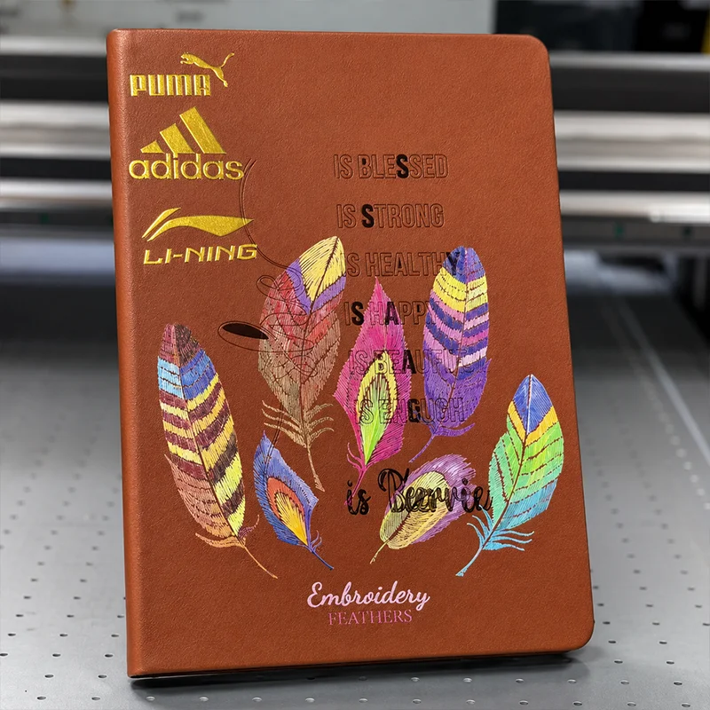 UV printing on leather notebook with colorful feather design