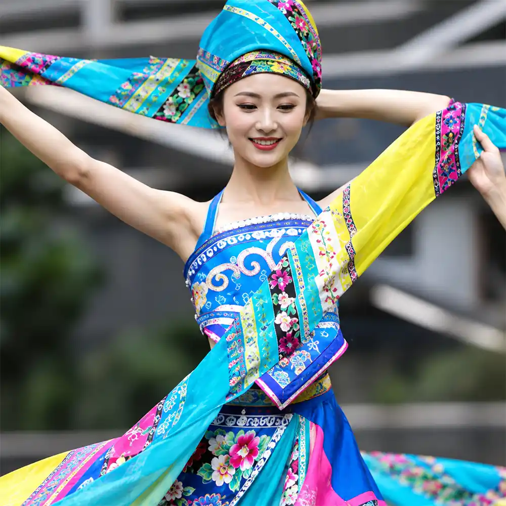 Woman wearing colorful patterned clothing showcasing sublimation printing applications for polyester apparel.